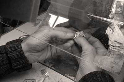 Handbrushing to perfect our sterling silver bangle caps
